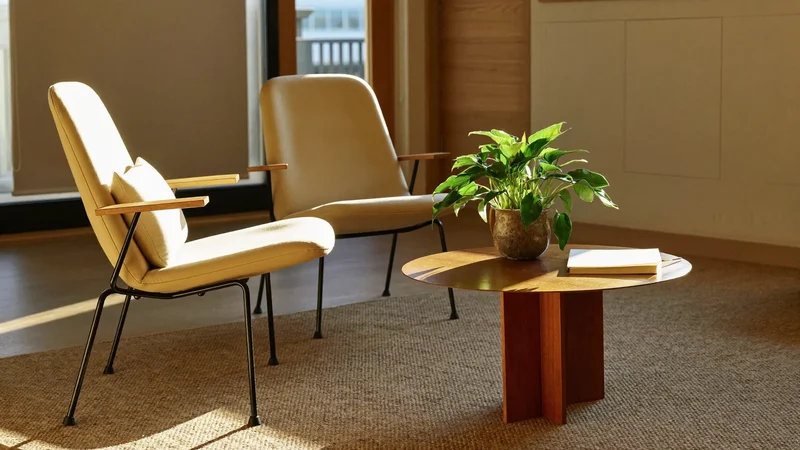 Illustration of a calm waiting area with cushioned chairs and a pot plant